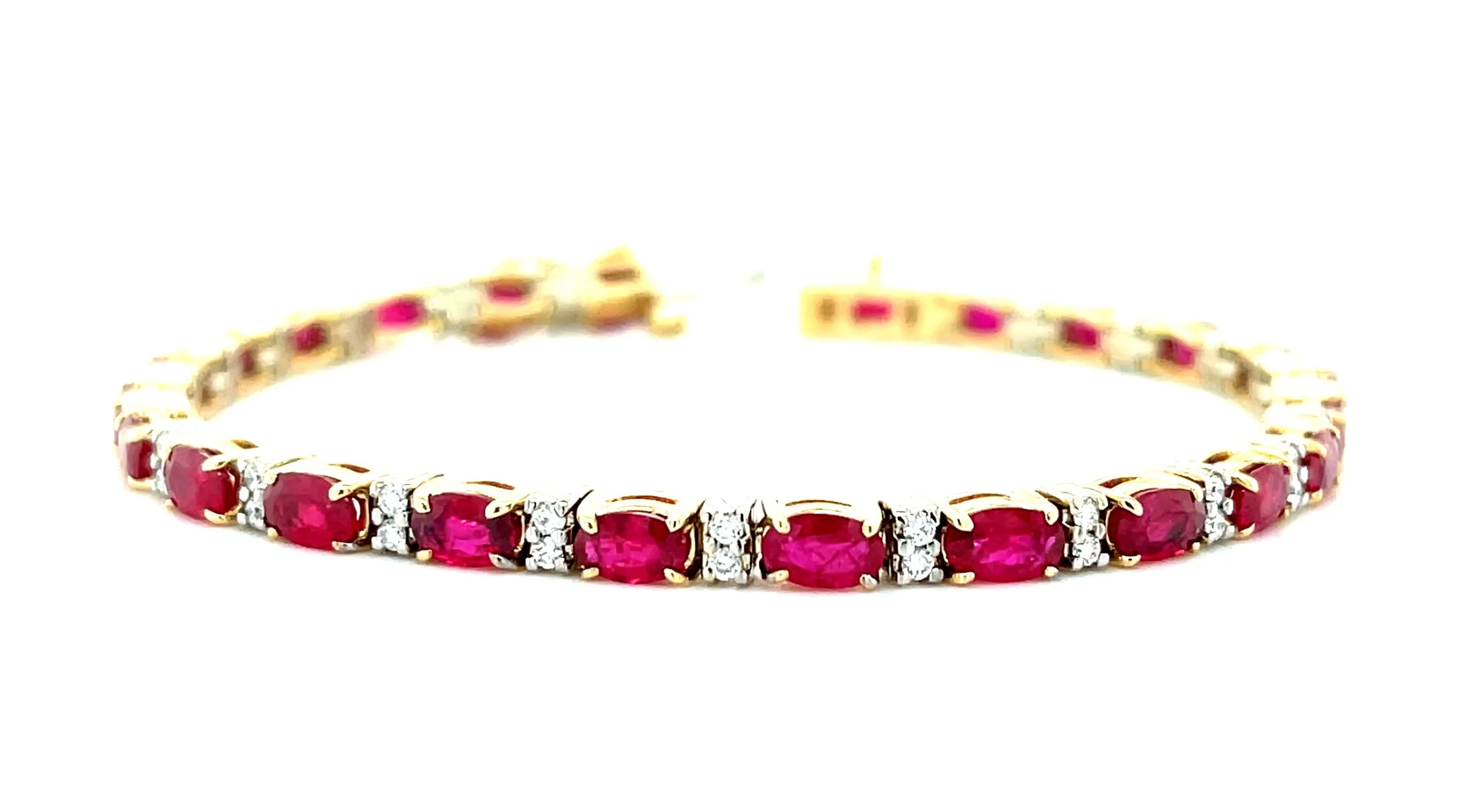 6.27 Carat Total Ruby and Diamond, Yellow and White Gold Tennis Bracelet