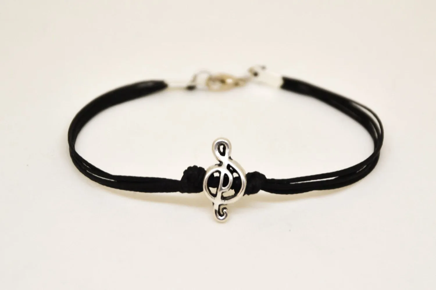 Silver Treble clef bracelet for men, black cords