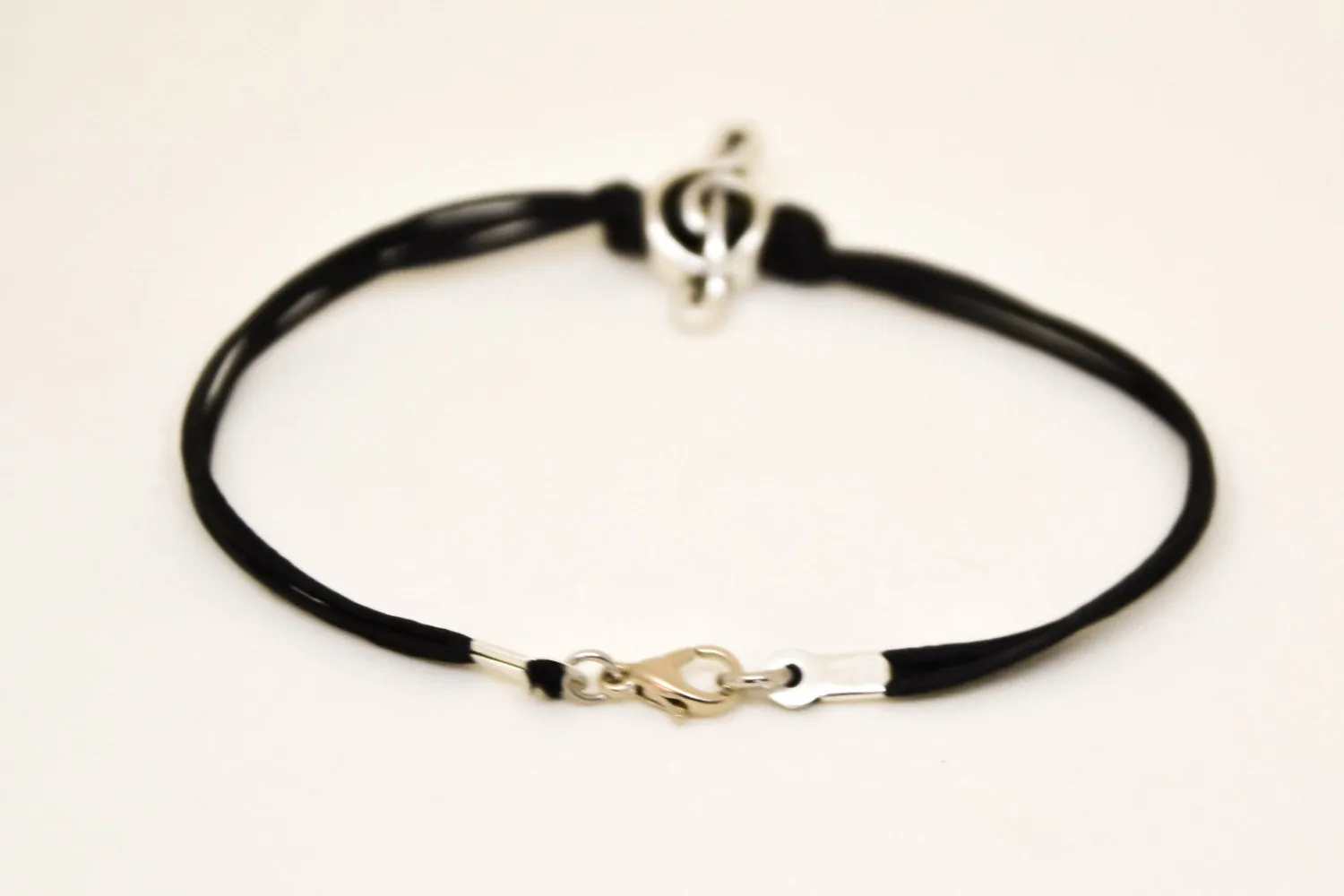 Silver Treble clef bracelet for men, black cords